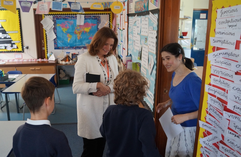 Gillian meeting staff and students 