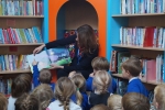 Gillian reading to the class