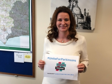 Gillian with #UniteforParkinsons poster 